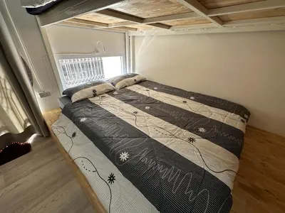 a bedroom with a bed in a small room at Letter Better Home in Bangkok