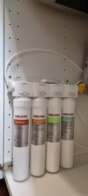 a group of white paint bottles in a drawer at homey stay and cafe by hematoa in Bangkok