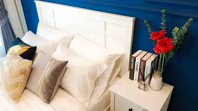 a group of pillows on a bed in a room at KnightsBridge BTS Bearing in Ban Khlong Samrong