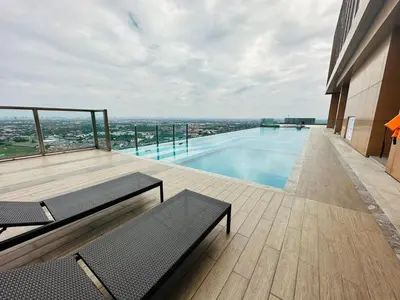 a swimming pool on the roof of a building at Near central westgate at bangyai 80 in Ban Bang Krabu