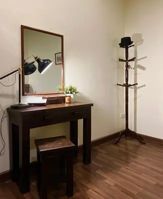 a dressing table with a mirror and a tripod at Niras Bankoc Hostel in Bangkok