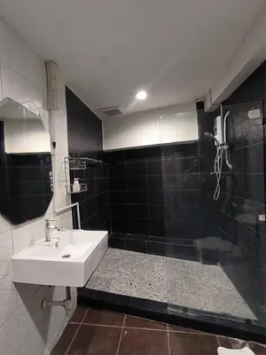 a bathroom with a sink and a shower at mstay in Bangkok