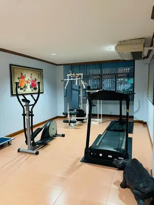 a room with a gym with a treadmill at Private rooms in Phatumwan Chula near Samyan, Chinatown, Jay-o Siam center, Central world middle of Bangkok in Bangkok