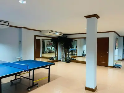 a ping pong table in the middle of a room at Private rooms in Phatumwan Chula near Samyan, Chinatown, Jay-o Siam center, Central world middle of Bangkok in Bangkok