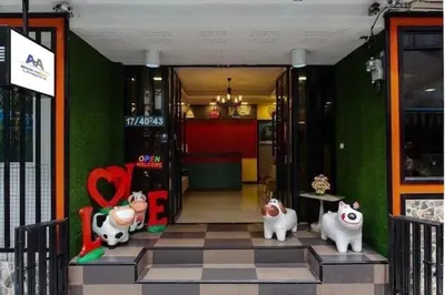 a front door of a store with figurines of cows at Anh Anh Homestay in Bangkok