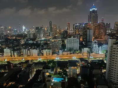 a view of a city at night with at Affordable Serviced Apartments in Nana Omni Tower - Prime Sukhumvit location in Bangkok