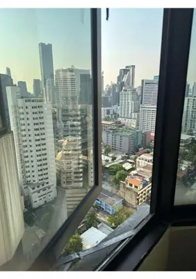 a view from an office window of a city at Affordable Serviced Apartments in Nana Omni Tower - Prime Sukhumvit location in Bangkok