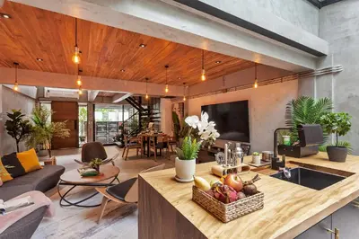 a living room with a table with fruit on it at Chic loft in Bangkok