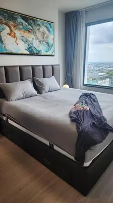 a large bed in a room with a window at 1 BR plus@42th FL /2-3 min walk to BTS MRT Ladprao in Bangkok