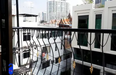 a view of a building from a balcony at Bed By City Hotel in Bangkok
