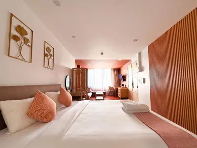 a bedroom with a large white bed in a room at SO Zen Hotel Silom Bangkok in Bang Rak