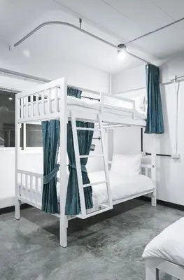 a couple of bunk beds in a room at G5 Hostel in Bangkok