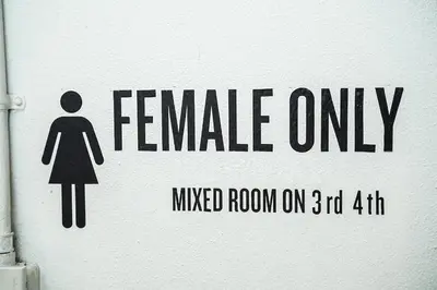 a sign that reads female only mixed room on at Qilombo Hostel Silom in Bangkok