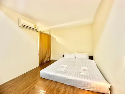 a small bedroom with a bed in a room at ABC SO Hotel Bangkok in Bangkok