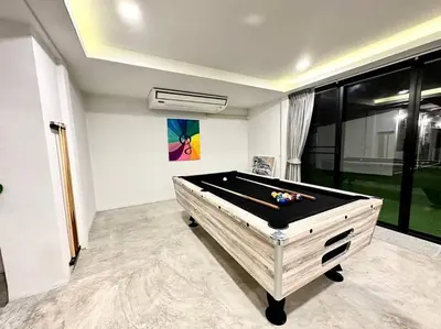 a room with a pool table in a room at Number3 Poolvilla Bangkok in Lat Krabang