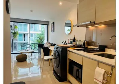 a kitchen with a sink and a stove top oven at Serene home in the heart of BKK - The Great Wave in Bangkok