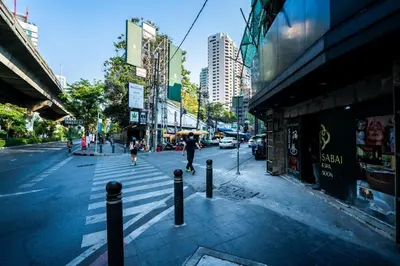a city street with people walking down the street at XX GO INN Sukhumvit-Bts Asoke-Phrom Phong โกอินน์ สุขุมวิท in Bang Kapi