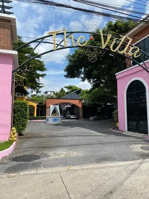 a sign that says the village in front of a building at เดอะวิลล่า71 รีสอร์ท in Ban Zong Katiam