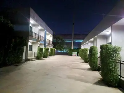 an empty hallway of a building at night at The Loftel Resort in Bangkok