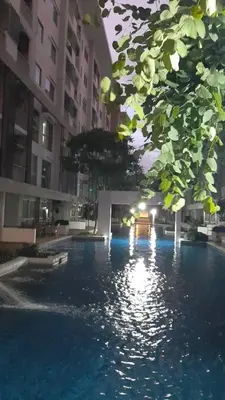 a swimming pool in the middle of a building at Green home in the big City in Bangkok