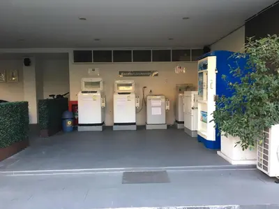 a row of old fashioned refrigerators in a building at Marigold Ramkhamhaeng in Bangkok