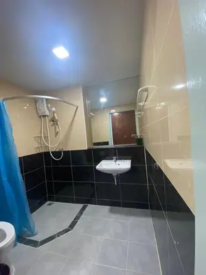 a bathroom with a sink and a shower at ศิวพฤกษ์ เพลส in Nonthaburi