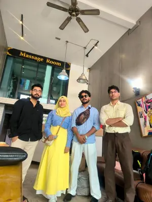 a group of men and a woman posing for a picture at Travel Bangkok BM B&B in Bangkok