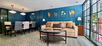 a living room with a couch and a table at BEB Silom Condolette in Bangkok