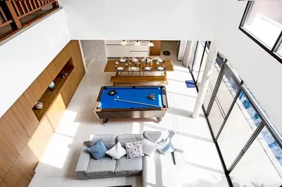 an overhead view of a living room with a pool table at Bangkok Luxury Pool Villa Thonglor in Bangkok
