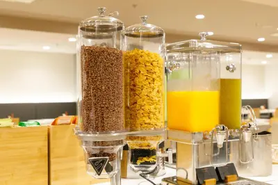 a group of containers of food and drinks on a counter at Nishitetsu Hotel Croom Bangkok Silom in Bangkok