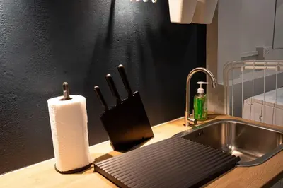 a kitchen counter with a sink and a roll of paper towels at A2 Comfortable space wt Kitchen in Bangkok