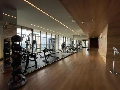 a gym with treadmills and machines in a building at Luxurious Apartment in Sukhumvit in Bangkok