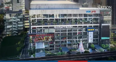 a large building with a christmas tree in front of it at Luxurious Apartment in Sukhumvit in Bangkok