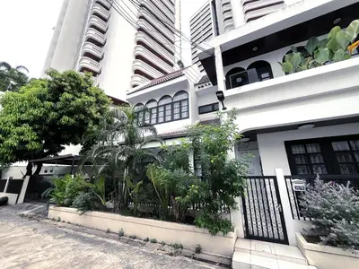 a white building with plants in front of it at Single house 4BR parking and kitchen in Sukhumvit49-1 in Bangkok