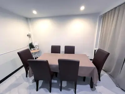 a dining room with a table and chairs at Single house 4BR parking and kitchen in Sukhumvit49-1 in Bangkok