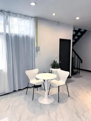 a white table and chairs in a room at Single house 4BR parking and kitchen in Sukhumvit49-1 in Bangkok