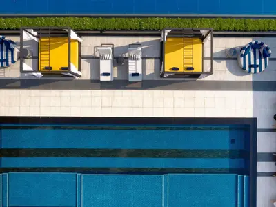 an overhead view of a swimming pool in a hotel at TRIBE Living Bangkok Sukhumvit 39 by AccorHotels in Bangkok