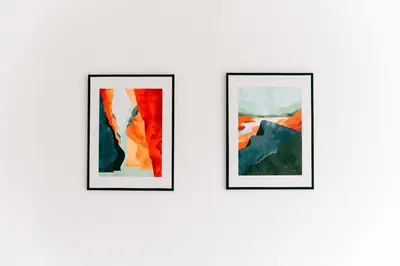 three framed paintings on a white wall at Mitt Haus (Lat Phrao Soi 5) in Bang Su