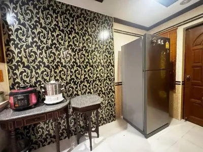 a kitchen with a black and white patterned wall at \u66fc\u8c37\u72ec\u680bLat Phrao\u7cbe\u54c1\u522b\u5885 in Bangkok