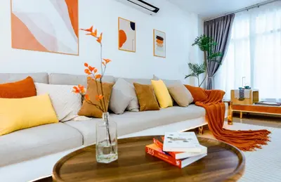 a living room with a couch and a table at Ratchada Retreat Bespoke Urban Villa 3 in Bangkok