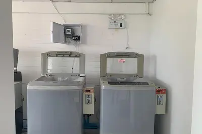 two machines sitting next to each other in a room at Na Nont Place in Bangkok