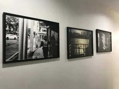 three framed photographs hanging on a wall at Manoo House H in Makkasan
