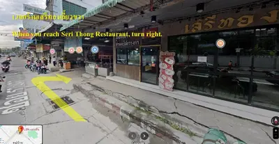 a view of a city street with a store at LSN Mansion in Bangkok
