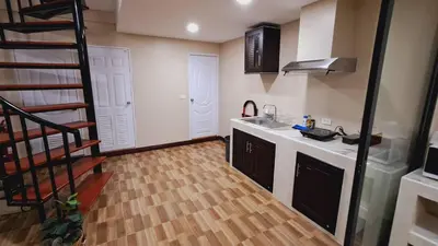 a kitchen with a sink and a counter top at NEW! KG home 3 Bedrooms/ Free Wi-Fi in Bangkok