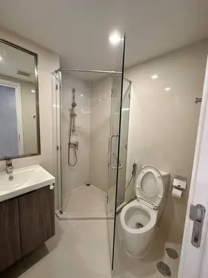 a bathroom with a shower and a toilet and a sink at Circle Rein Sukhumvit 12 two bedrooms apartment in Khlong Toei