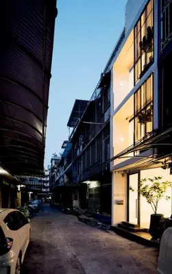a city street with buildings and a car parked on the street at MIQ_5br/Silom Bts,Mrt/Wifi 1000MB/Jacuzzi/16pax in Bangkok