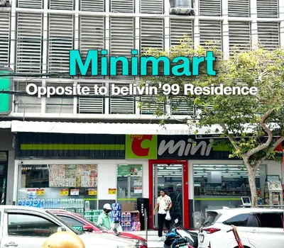 a min mart sign on the side of a building at Belivin99 Residence Chinatown in Bangkok