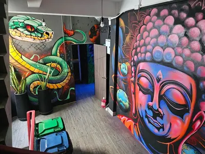 a room with a painting on the wall at Urban Jungle Social in Bangkok