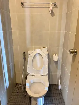 a bathroom with a toilet with the lid up at Ideo O2 BTS Bangna in Bangkok