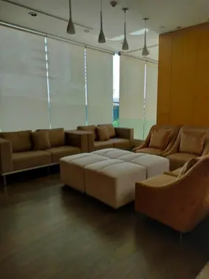 a living room with a couch and two couches at Ceil by Sansiri BTS Ekamai Shuttle to BTS Ekamai , Gateway mall , Major Cineplex mid city. Great place to explore bangkok in Bangkok